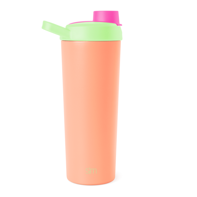 Peach pink water bottle with bright lime green lid assembly