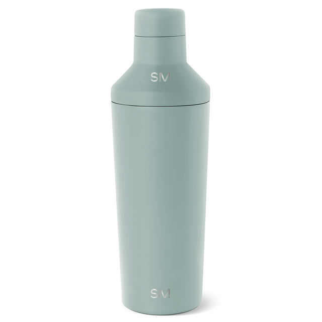 Sage green cylindrical bottle with matching cap on white background