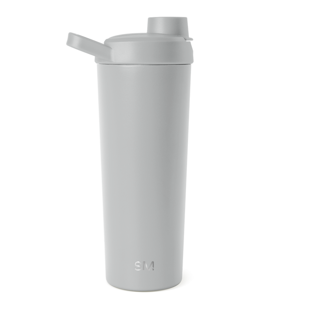 Soft gray water bottle with rounded cylindrical shape and secure cap, displayed against a white studio background