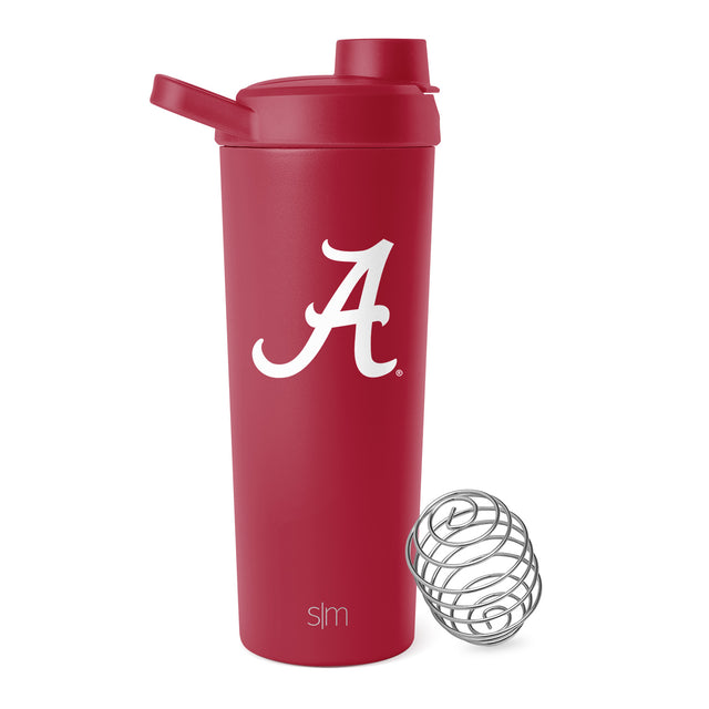 Deep crimson red glass bottle with matching red cap and silver metal shaker ball accessory for cocktail mixing.
