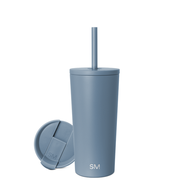 Soft blue-gray insulated tumbler with matching lid, featuring a muted dusty blue-teal finish in a calming, cohesive color palette.