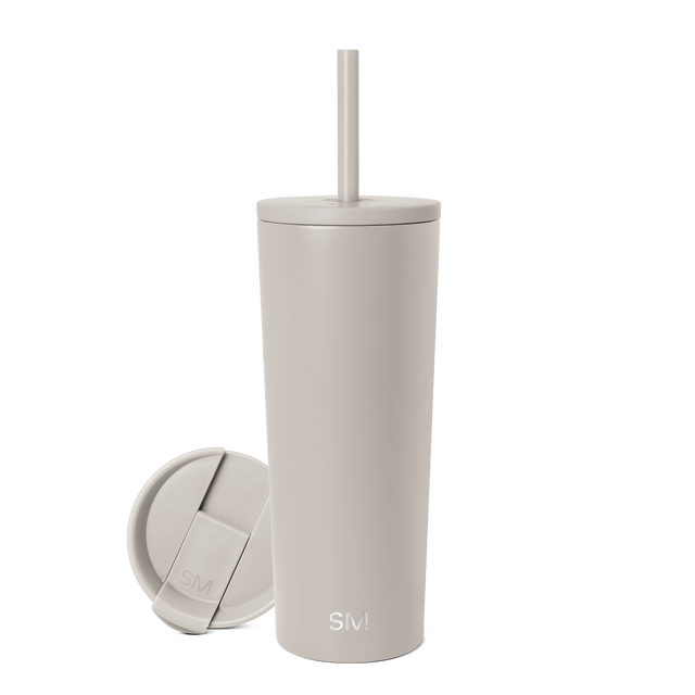 Beige tumbler with matching lid and straw on neutral background