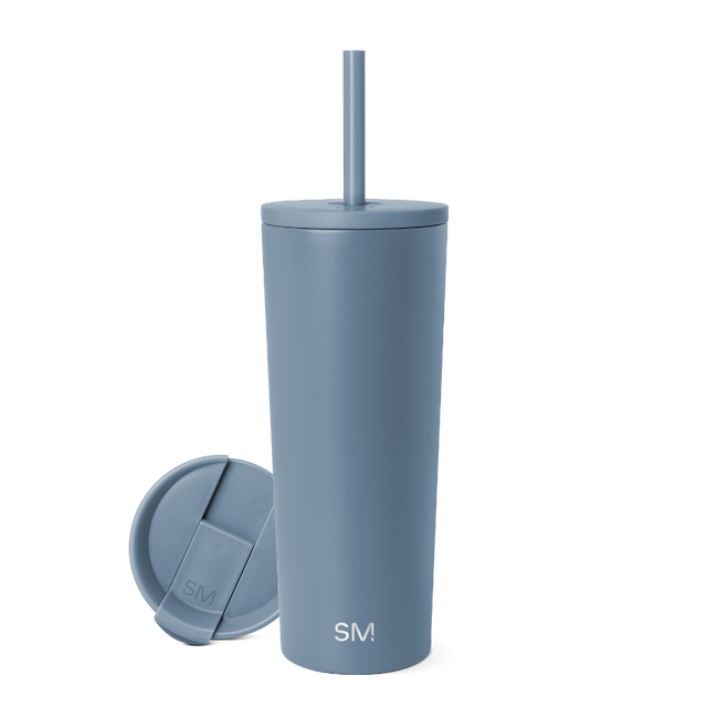 Soft blue-gray insulated tumbler with matching lid and straw on neutral background