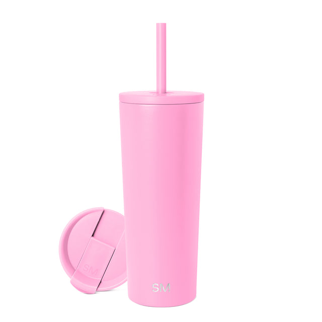 Light pink tumbler with matching lid and straw on white background