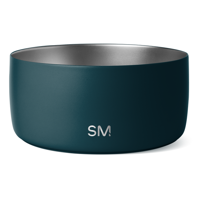 Deep teal cylindrical bowl with matte exterior and polished metallic silver interior, shown against white background.