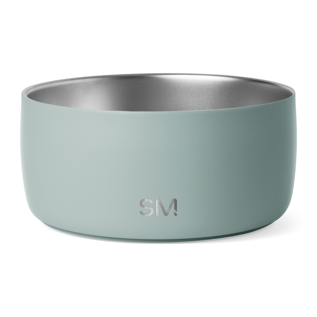 Sage green ceramic bowl with brushed stainless steel interior, metallic silver-gray finish