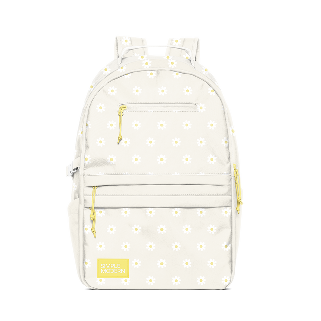 Cream backpack with yellow accents and small white daisy flowers with pale yellow centers printed throughout the bag