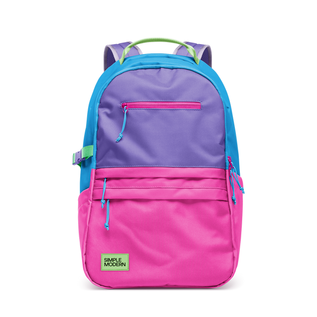 Colorful block design backpack with hot pink lower section, bright cyan blue side panels and top frame, and soft purple accents