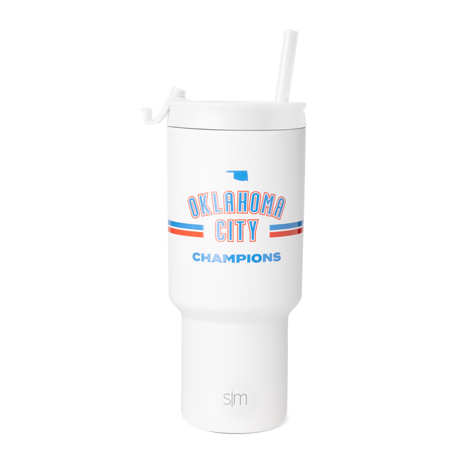 White tumbler with bright blue and orange-red graphic design and decorative stripes
