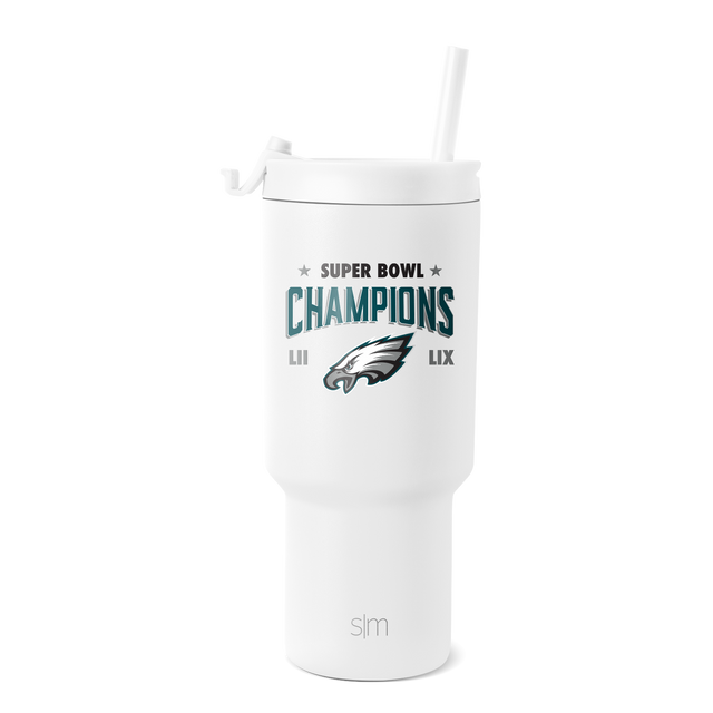 White tumbler with teal blue text, dark gray eagle logo, navy accents, and star graphics