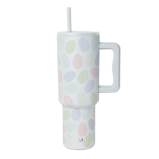 White tumbler with soft pastel-colored ovals in pale yellow, light pink, lavender blue, and mint green scattered across the surface.