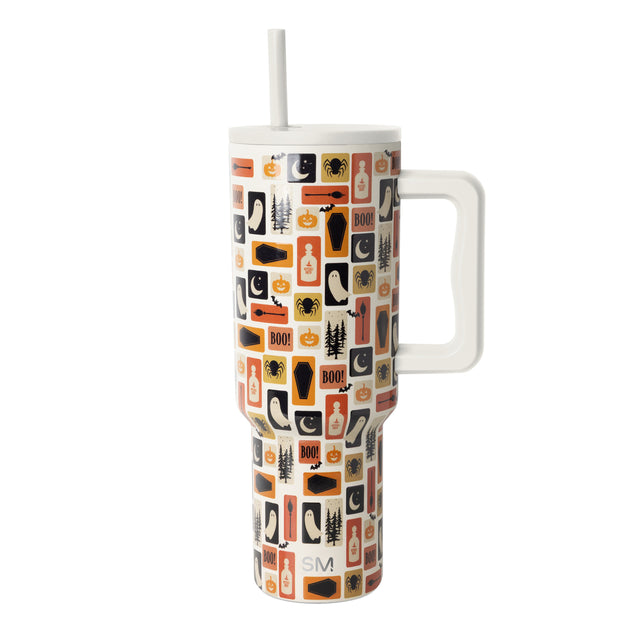 Tall stainless steel tumbler with handle in cream, orange, black, and tan striped pattern by Simple Modern on white background.