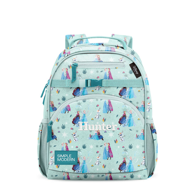 Mint green children's backpack with teal straps, multiple zippered pockets, and colorful Frozen-inspired pattern. Features 
