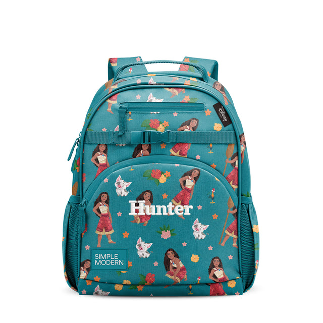 Teal Simple Modern backpack with Moana-inspired pattern featuring character illustrations, colorful flowers, and foliage. Multiple compartments, padded straps, and 