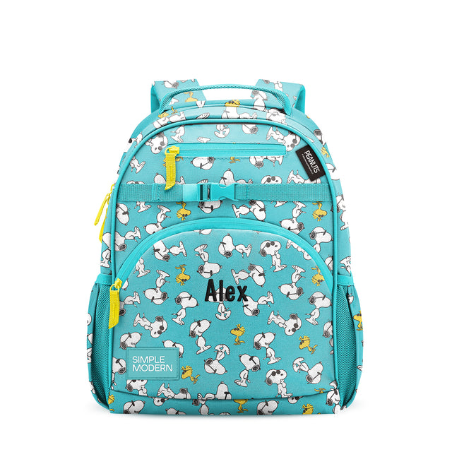 Turquoise children's backpack with cartoon dogs and birds, yellow zipper pulls, padded straps, multiple pockets, and 