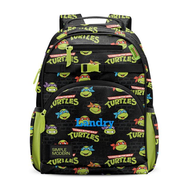 Black Teenage Mutant Ninja Turtles backpack with neon lime green accents, colorful character graphics, front zippered pocket labeled 
