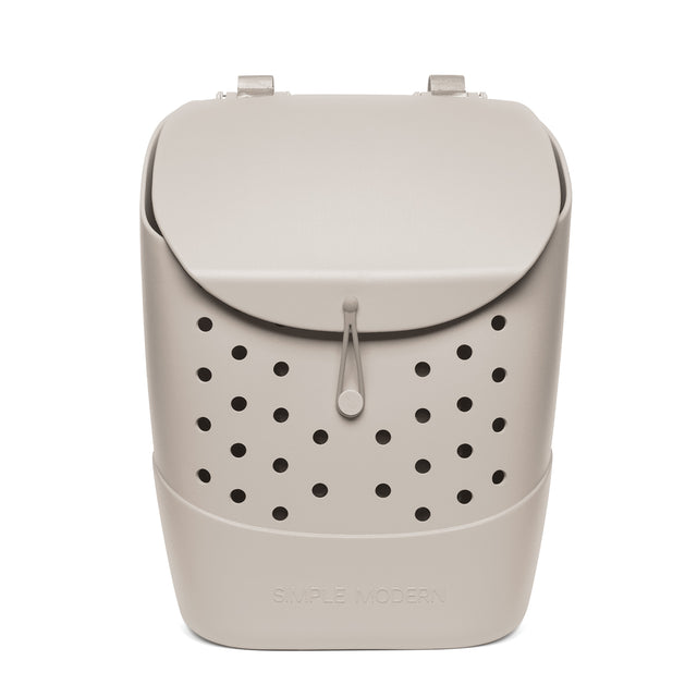 Beige cream-colored product with black circular perforations throughout, creating monochromatic design with contrast detailing