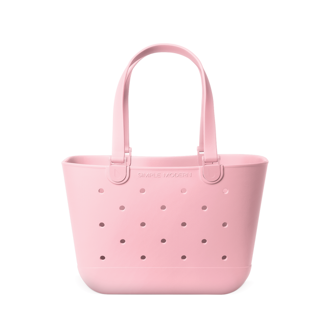 Soft pale pink tote bag with mauve perforated detailing across the front for subtle contrast