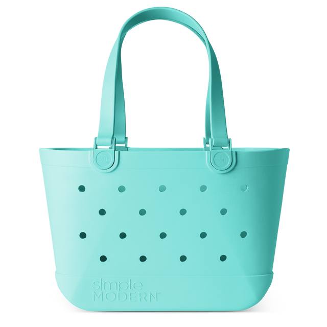 Light turquoise canvas tote bag with darker teal accents, displayed against a white background.