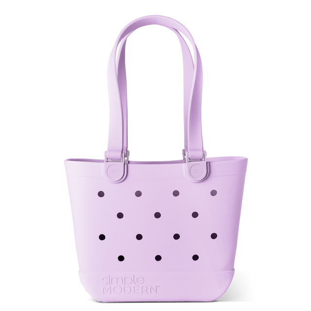 Soft pale lavender background with dark navy and charcoal black dots scattered throughout, creating contrast and visual interest.