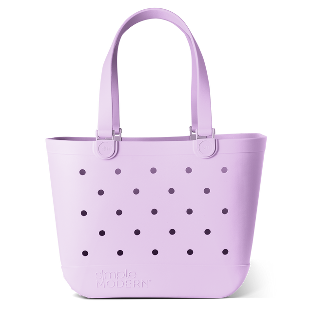 Soft lavender tote bag with dark purple circular perforations and handles visible