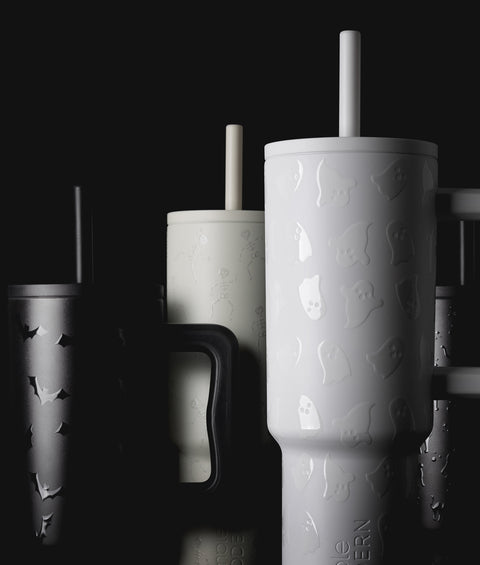 Group of white drinkware with gray shadows on black background, harvest-themed product collection shot