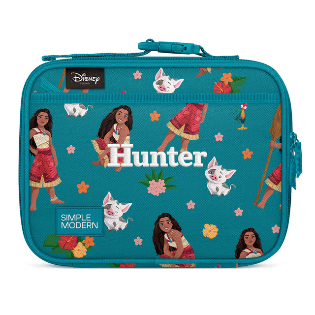 Teal insulated lunch box featuring Disney's Moana character artwork with tropical flowers, stars, and white cat designs. Includes teal carrying handle, side zippered pocket, and personalized 