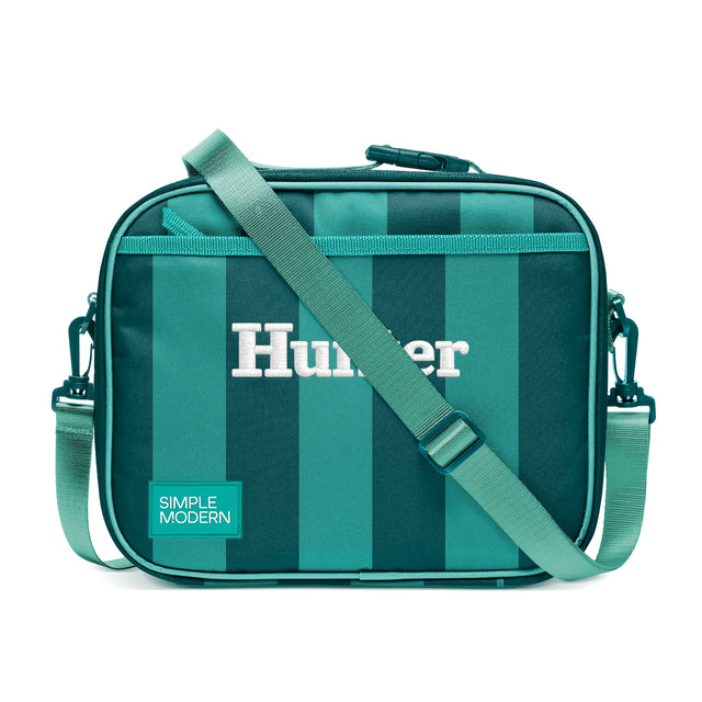 Simple Modern Hunter crossbody lunch bag with teal and turquoise vertical stripes, adjustable shoulder strap, top zipper closure, and side handles on white background.