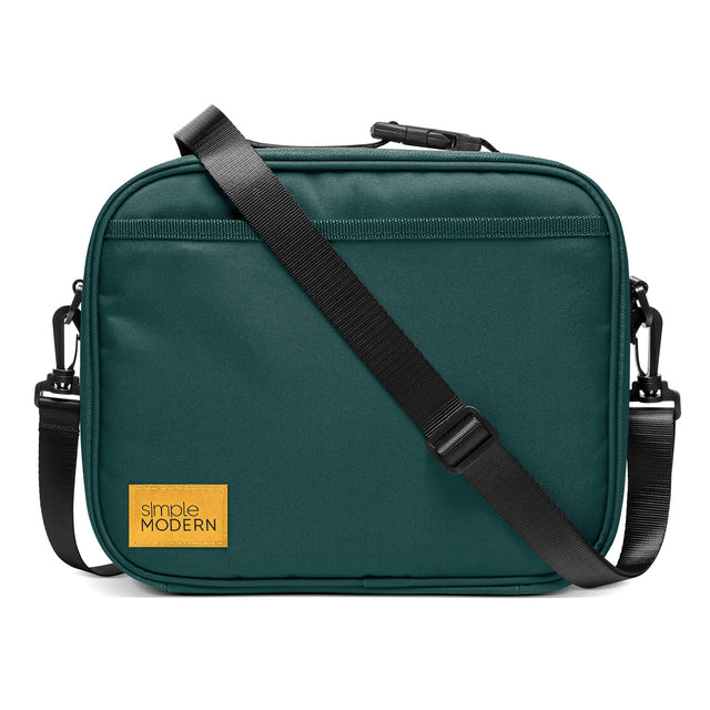 Teal crossbody bag with golden yellow brand accent