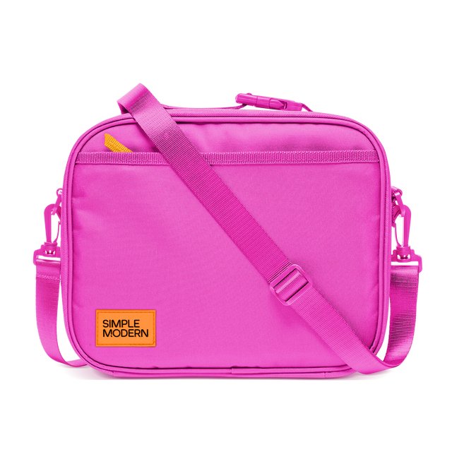 Hot pink shoulder bag with bright yellow-orange zipper pulls and branding accents