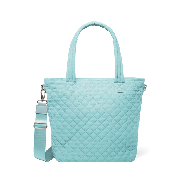 Soft aqua mint green tote bag with silver metal hardware and handles, front view