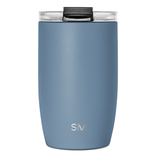 Slate blue insulated tumbler with black handle and clear glass rim, viewed from front angle
