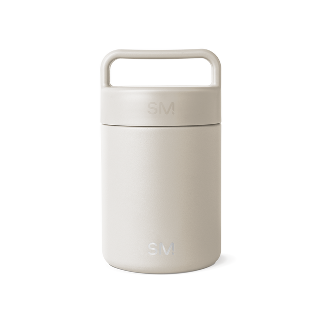 Cream-colored jar with lid on white background