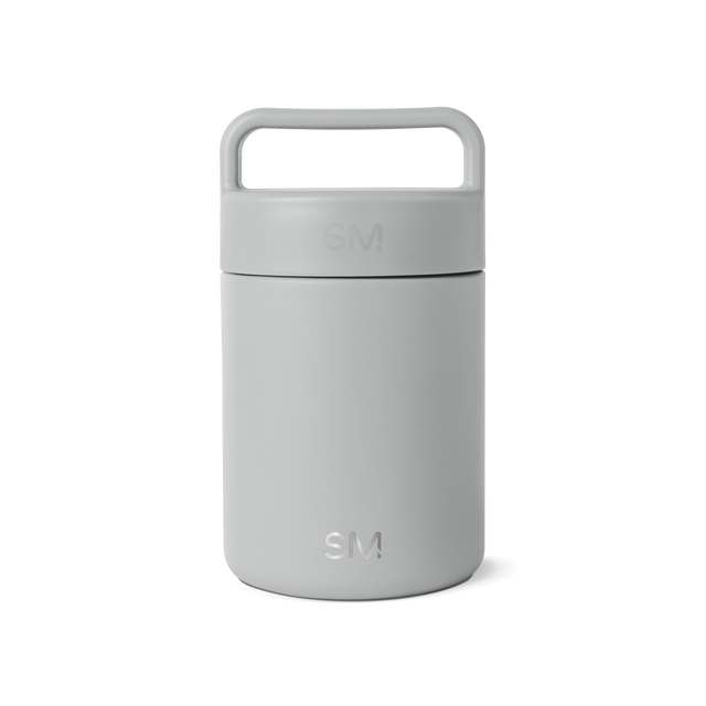 Gray-silver cylindrical jar with handle on white background