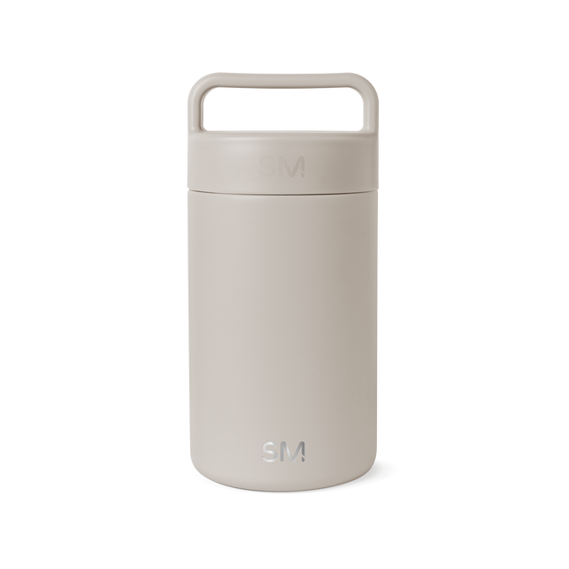 Beige cylindrical jar with matching lid on white background