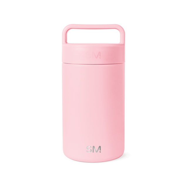 Soft pale pink ceramic jar with lid against white background