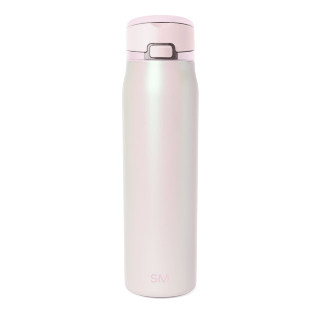 Pale pink and cream gradient cylindrical bottle with light pink cap and gray hardware accents