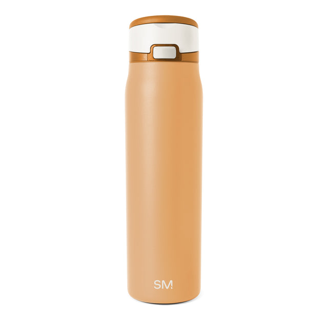 Insulated tumbler with warm peachy-tan body and cream-colored lid band and interior rim