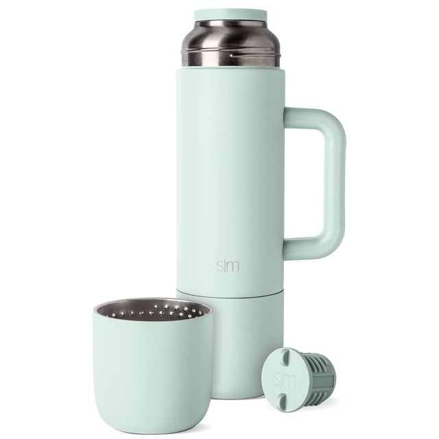 Soft mint green drinkware set displayed from the front, showing pale sage-green colored cups or mugs with a muted, gentle finish suitable for everyday use.