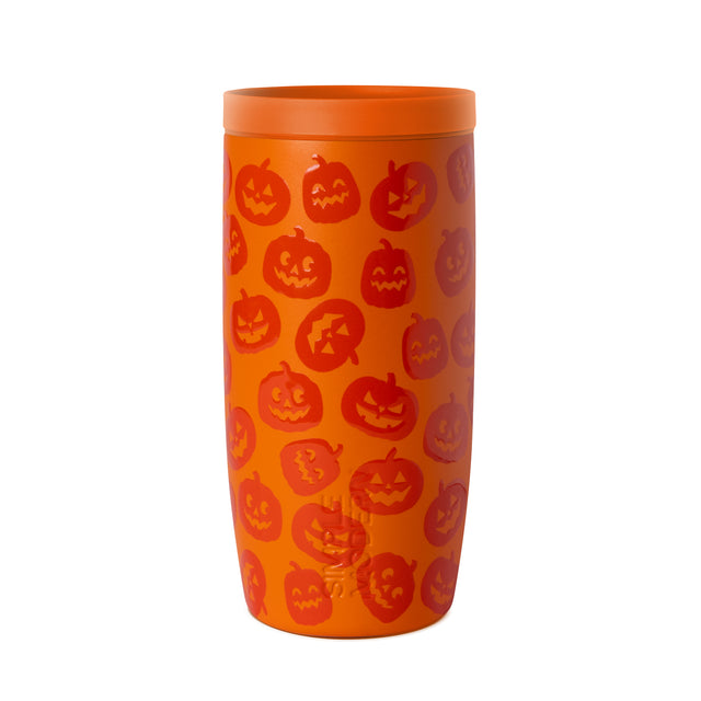 Bright orange tumbler with dark red jack-o'-lantern face illustrations printed around the cylindrical surface, orange rim and lid included.