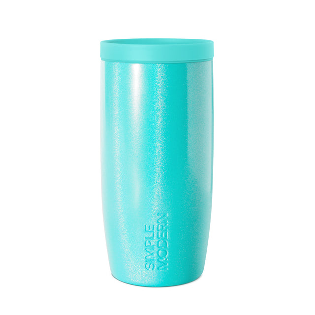 Bright turquoise glitter tumbler with iridescent sparkly finish and shimmering reflections across the surface.