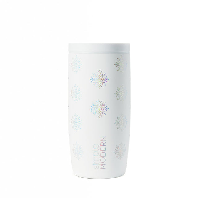 White insulated tumbler with pastel snowflake motifs in light blue, pale purple, muted gold, and gray.