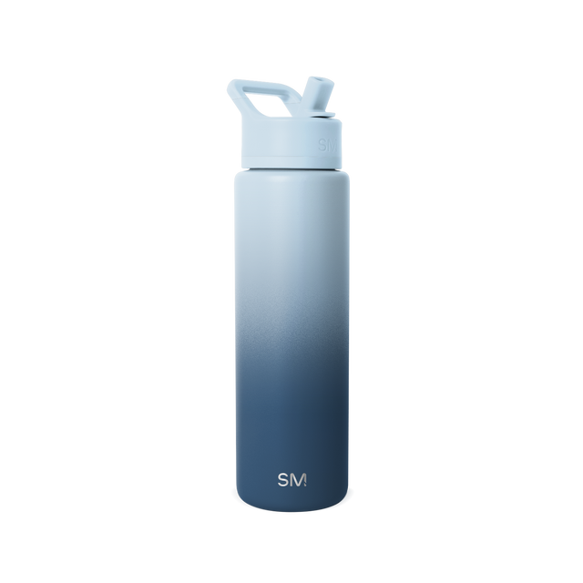 Ombre water bottle with pale blue-gray fading to deep navy blue, featuring matching pale blue cap and handle assembly.