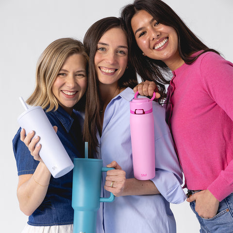 Pastel spring drinkware collection featuring soft pink, lavender-blue, and white mugs and cups displayed on a clean white background.
