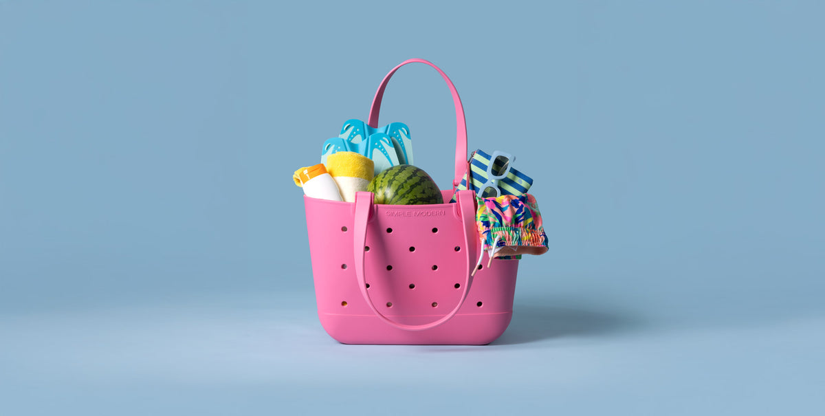 Bright blue background with vibrant hot pink stuffed tote bag