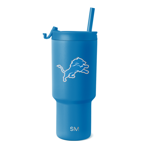 Blue Detroit Lions Trek tumbler with a straw lid