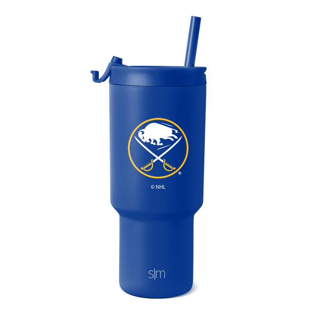 Cobalt blue matte tumbler with white and gold logo accents