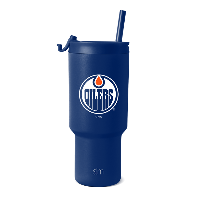 Royal blue tumbler with white text branding and orange accent details