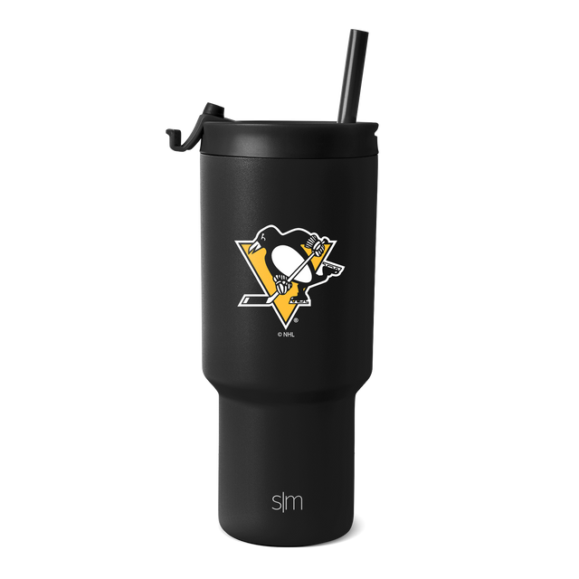 Matte black tumbler with gold and white logo accents on white background