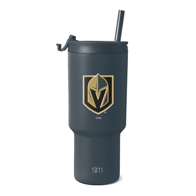 Deep charcoal gray tumbler with gold and tan logo accents, featuring a black shield design on the front